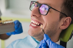 Smiling man getting dental implants in Weyauwega