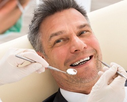 An older gentleman receiving dental care by a holistic dentist