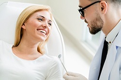 Woman talking to cosmetic dentist in Weyauwega