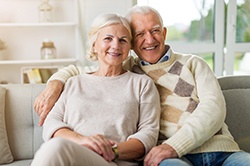 Couple smiles after receiving dentures in Weyauwega