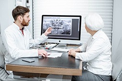 Patient listening to dentist in Weyauwega