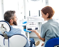 dentist explaining X-ray to patient