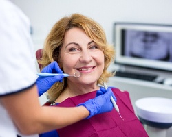 Woman after dental implant salvage in Weyauwega