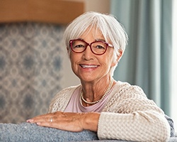 Woman with implant dentures in Weyauwega