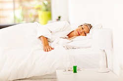 Woman resting with dental implants in Weyauwega