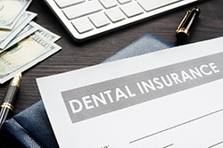 Dental insurance paperwork for the cost of dental implants in Weyauwega