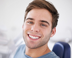 Smiling man in dental chair