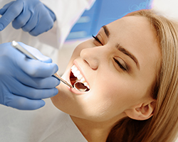 Woman receiving dental treatment