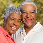 Smiling senior man and woman outdoors