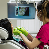 Dental assistant capturing intraoral photos