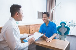 patient talking to dentist about financing options 