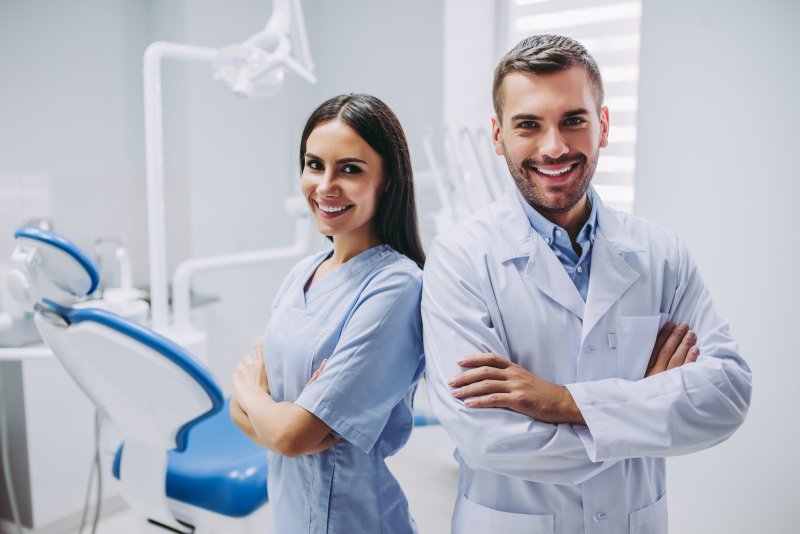 a holistic dentist in Weyauwega and a dental assistant smiling