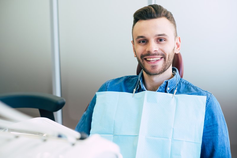 man visiting dentist for a dental checkup