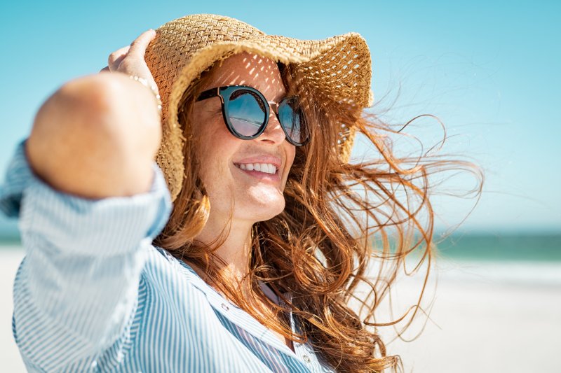 woman at the beach smiling