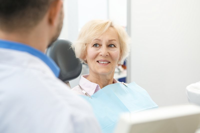 woman with implant dentures