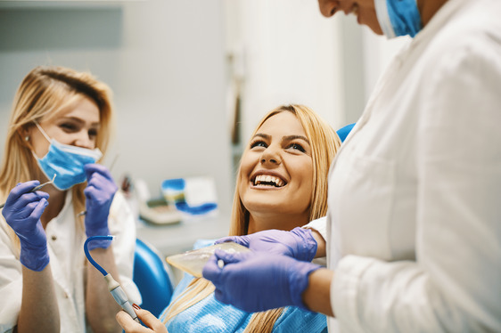 patient smiling while visiting holistic dentist 