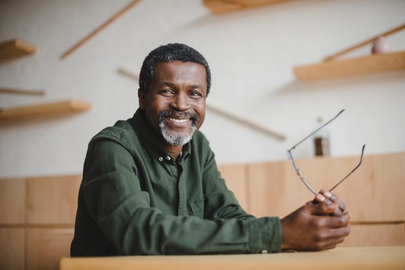 man smiling with dentures in mouth 