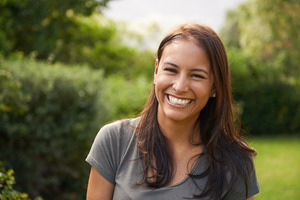 Woman taking a walk outside and smiling